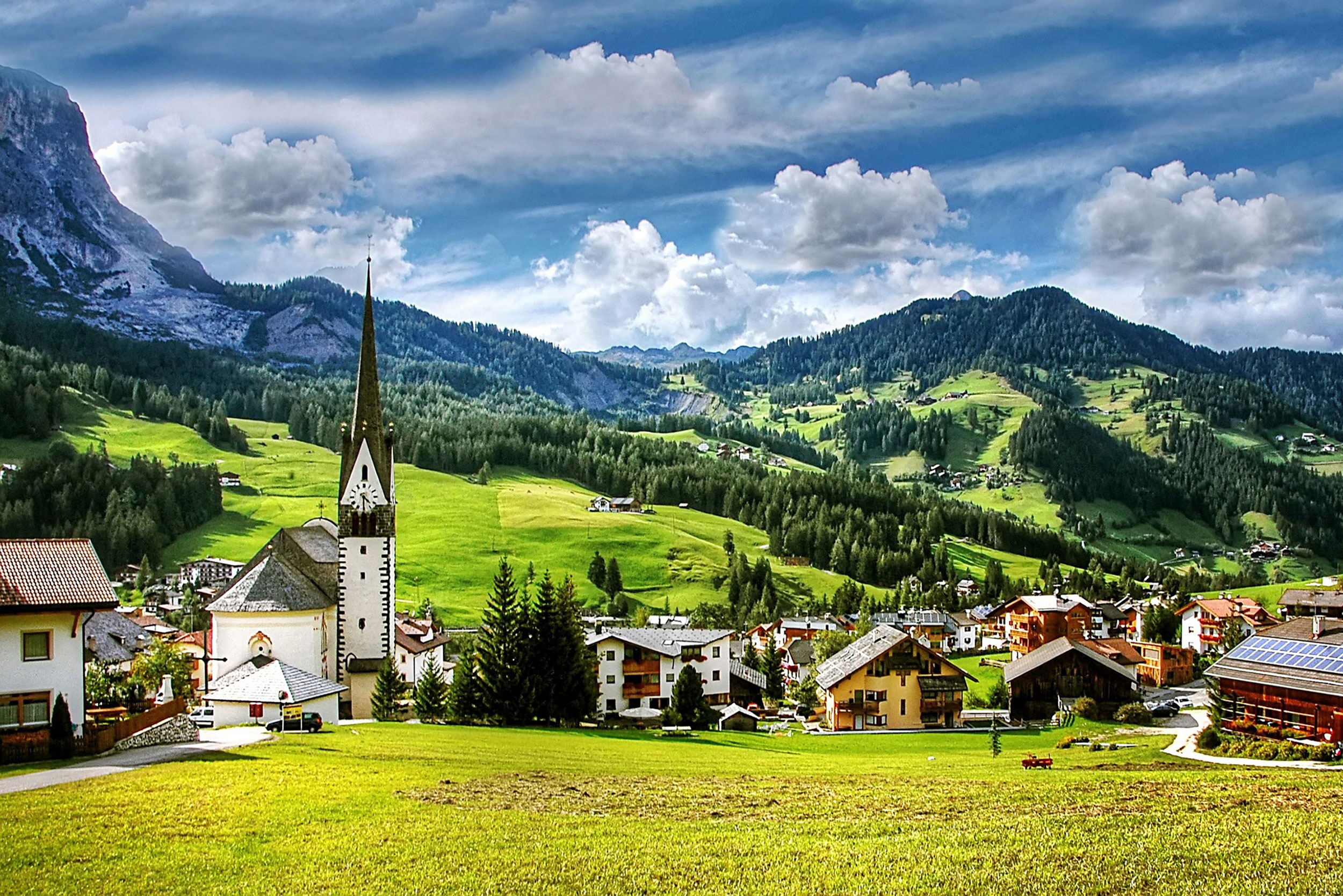 a town with a steeple and buildings in the background